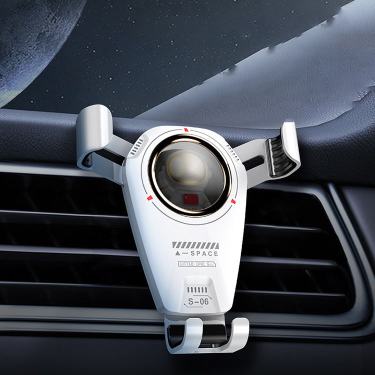 Universal car phone holder with astronaut theme mounted on car air vent.