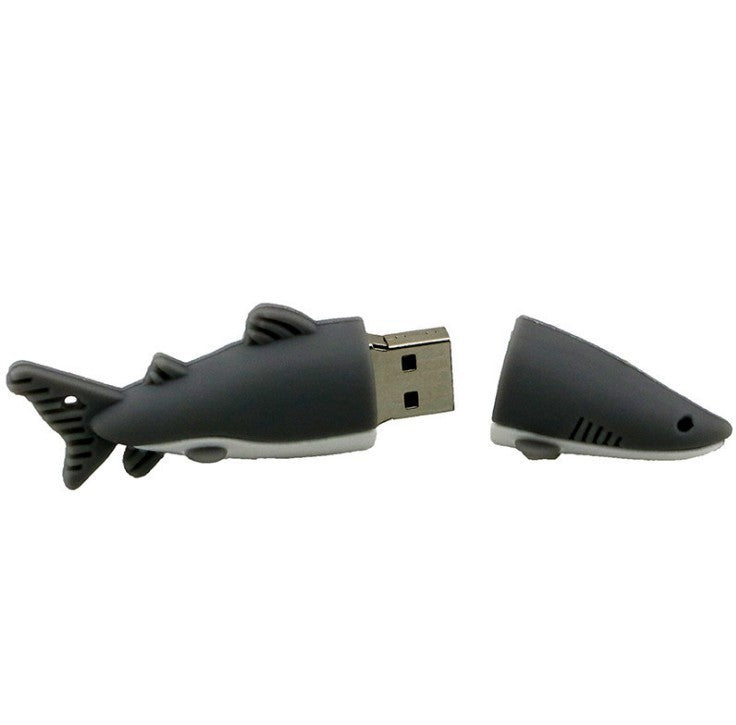Cartoon shark shaped USB flash drive with removable cap and USB 2.0 interface.