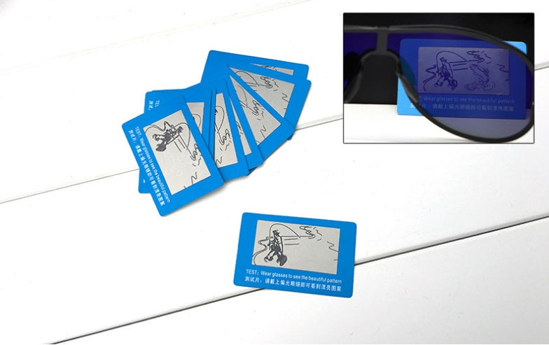 Black eyewear cases with blue test cards for seeing patterns with glasses.
