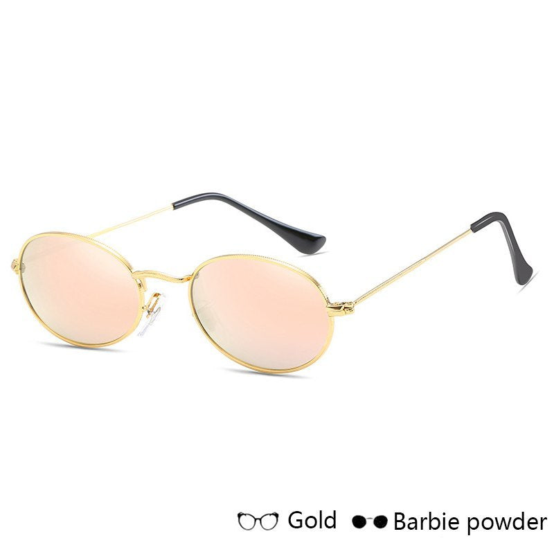 Luxury women's sunglasses with gold metal oval frames and UV400 mirror lenses.