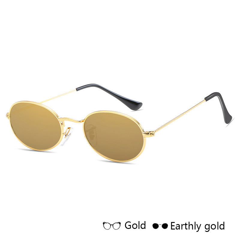 Luxury oval metal frame women’s sunglasses in gold with UV400 protection.