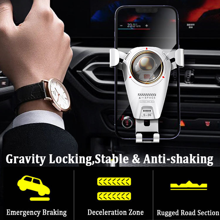 Universal car phone holder with 360-degree rotation, astronaut theme, mounted on car air vent with metal hook clip.