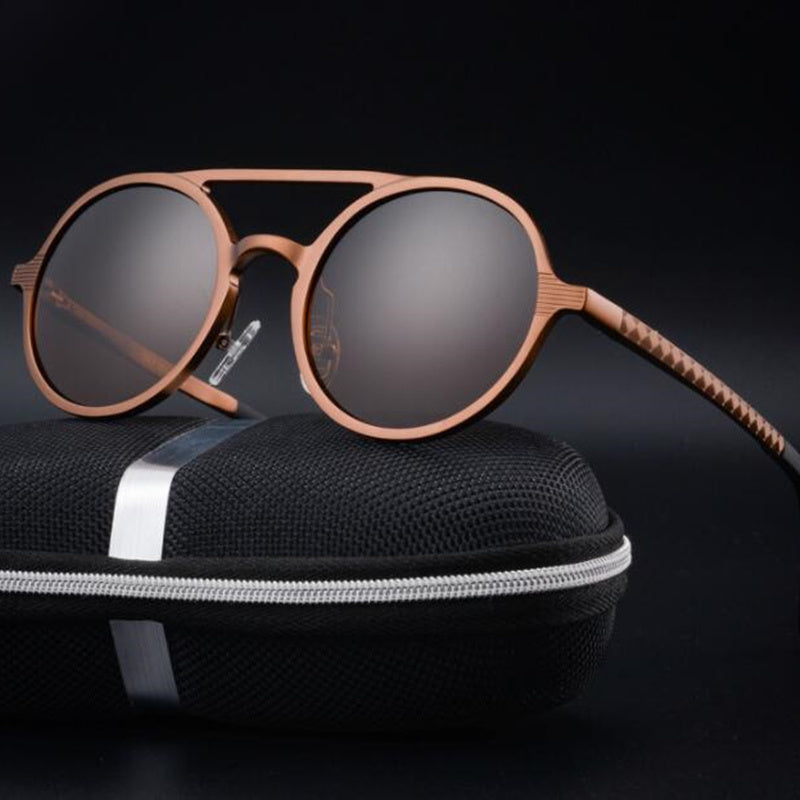 Retro aluminum magnesium round sunglasses with polarized lenses on a black case.