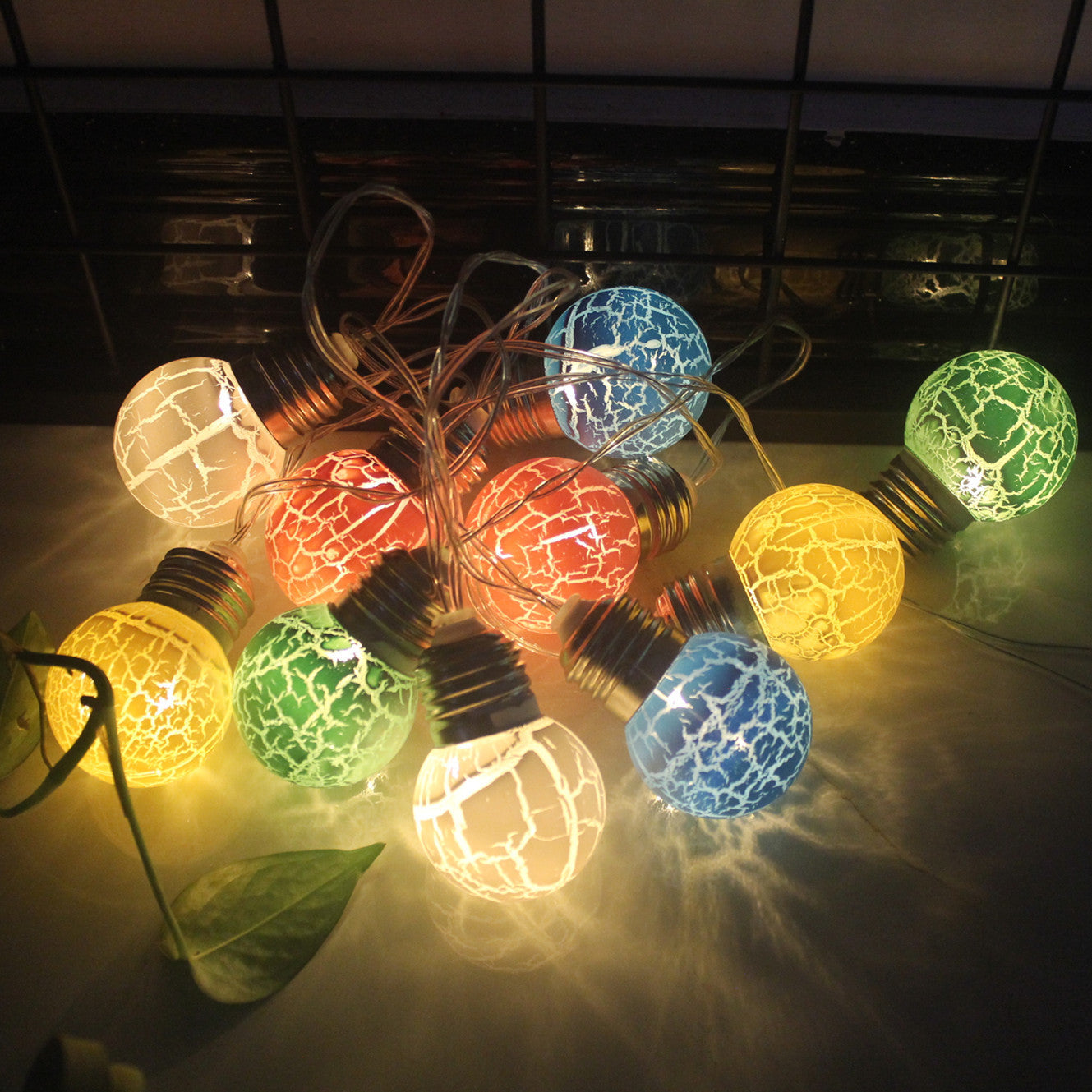 Colorful cracked bulb LED string lights for festive decoration with warm glow